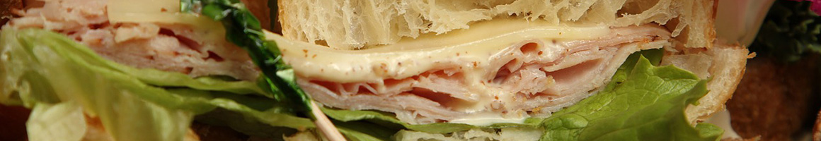 Eating Sandwich at Blazing Bagels restaurant in Bellevue, WA.
